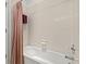 Bathroom featuring a neutral tub and shower combo with ceramic tile surround at 8704 Sandy Plains Dr, Riverview, FL 33578