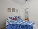 Bright bedroom featuring a double bed, decor, and an ensuite bathroom at 8704 Sandy Plains Dr, Riverview, FL 33578