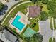 Aerial view of community pool, basketball court, with a clubhouse and parking area at 8704 Sandy Plains Dr, Riverview, FL 33578