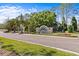 Attractive Amberly neighborhood entrance sign surrounded by mature trees and landscaping at 8704 Sandy Plains Dr, Riverview, FL 33578