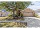 Charming single-story home with well-maintained lawn and a spacious two-car garage at 8704 Sandy Plains Dr, Riverview, FL 33578