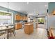Spacious kitchen with tile flooring, an island, and a breakfast nook by the window at 8704 Sandy Plains Dr, Riverview, FL 33578