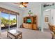 Cozy living room featuring neutral carpet, outdoor access, and modern decor at 8704 Sandy Plains Dr, Riverview, FL 33578