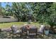 Outdoor dining area features a table with chairs, ideal for entertaining at 907 Tyner St, Plant City, FL 33563