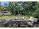 Backyard has outdoor dining area and built-in grill, perfect for outdoor entertaining at 907 Tyner St, Plant City, FL 33563