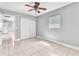 The bedroom features tile flooring, ceiling fan and a closet at 907 Tyner St, Plant City, FL 33563