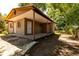 Rear of the house with a concrete patio area and access to the backyard at 907 Tyner St, Plant City, FL 33563