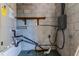 A utility room with a water heater and an energy efficient HVAC unit at 907 Tyner St, Plant City, FL 33563