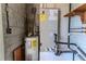 A utility room featuring a water heater and an energy efficient HVAC unit at 907 Tyner St, Plant City, FL 33563