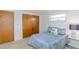 Bedroom featuring a comfortable bed and ample natural light at 9205 Ledgestone Ln, Port Richey, FL 34668
