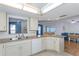 Open kitchen design overlooking the living spaces, with updated appliances and plenty of storage at 9205 Ledgestone Ln, Port Richey, FL 34668