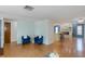 Open living space with hardwood floors, leading to the kitchen and dining area, perfect for entertaining at 9205 Ledgestone Ln, Port Richey, FL 34668