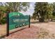 Image shows the sign for Lake Lisa Park with a playground, picnic shelter, and recreation at 9205 Ledgestone Ln, Port Richey, FL 34668