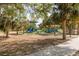Image shows a colorful playground and park at 9205 Ledgestone Ln, Port Richey, FL 34668
