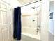 Clean bathroom featuring a bathtub with shower and a modern rainfall shower head at 9650 Lake Chase Island Way # 9650, Tampa, FL 33626