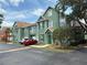 Inviting townhouse complex with well-maintained landscaping and parking, offering a community-focused living experience at 9650 Lake Chase Island Way # 9650, Tampa, FL 33626