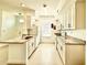 Spacious kitchen with granite countertops, white cabinetry and modern appliances at 9650 Lake Chase Island Way # 9650, Tampa, FL 33626