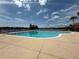 Community pool area with sparkling blue water, perfect for relaxation and recreation at 9650 Lake Chase Island Way # 9650, Tampa, FL 33626