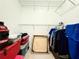 Spacious walk-in closet with wire shelving and ample storage space for clothes and personal items at 9650 Lake Chase Island Way # 9650, Tampa, FL 33626