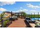 A spacious roof deck with comfortable seating and beautiful views of the surrounding nature at 107 Athenian Way, Tarpon Springs, FL 34689