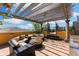 Inviting rooftop terrace with lounge seating, pergola, and picturesque neighborhood views at 107 Athenian Way, Tarpon Springs, FL 34689