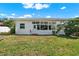 Exterior shot of a house with a well-maintained backyard and lush greenery at 10828 99Th Pl, Seminole, FL 33772