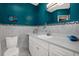 Updated bathroom with custom tiled backsplash, white vanity, and ample storage at 10828 99Th Pl, Seminole, FL 33772