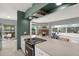 Stylish kitchen with a pass-through window to the living room, modern appliances, and seamless design for entertaining at 10828 99Th Pl, Seminole, FL 33772