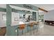 Open-concept kitchen featuring a breakfast bar, modern appliances, and ample counter space for cooking and entertaining at 10828 99Th Pl, Seminole, FL 33772
