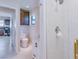Well lit bathroom with shower, vanity and toilet at 1104 Northridge Dr, Palm Harbor, FL 34683