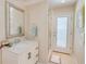 Bathroom with white vanity and glass enclosed shower at 1104 Northridge Dr, Palm Harbor, FL 34683