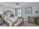 Charming bedroom featuring natural light, neutral walls, and decoratively framed pictures at 1104 Northridge Dr, Palm Harbor, FL 34683
