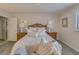 This bedroom features matching nightstands, a queen-sized bed, and a view of the outside at 1104 Northridge Dr, Palm Harbor, FL 34683