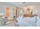 This primary bedroom has an ensuite bathroom, carpet floors, and light colored walls at 1104 Northridge Dr, Palm Harbor, FL 34683
