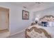 Comfortable bedroom featuring an ornate headboard, soft pillows, and a ceiling fan at 1104 Northridge Dr, Palm Harbor, FL 34683