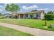 Well maintained lawn and landscaping add to the curb appeal of this charming one story home at 1104 Northridge Dr, Palm Harbor, FL 34683