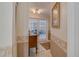 Foyer view showcasing tile flooring and elegant wall decor leads into the bright living space at 1104 Northridge Dr, Palm Harbor, FL 34683