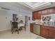 Kitchen and dining area featuring modern appliances, stylish decor, and ample natural light at 1104 Northridge Dr, Palm Harbor, FL 34683