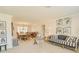 Spacious living area with dining space, stylish seating, decorative art, and ample natural light at 1104 Northridge Dr, Palm Harbor, FL 34683