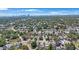 An aerial view showcases the property's location within a residential neighborhood with a distant city skyline backdrop at 1110 36Th N Ave, St Petersburg, FL 33704