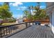 Back deck overlooking a backyard with a detached garage, a wood fence and various trees at 1110 36Th N Ave, St Petersburg, FL 33704