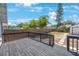 Back deck overlooking a backyard, featuring a wood fence and various trees at 1110 36Th N Ave, St Petersburg, FL 33704