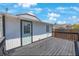 Back deck with a door to the house, a view of the backyard and a wood railing at 1110 36Th N Ave, St Petersburg, FL 33704