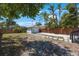 Backyard with a detached garage, a wood fence and a stone walkway at 1110 36Th N Ave, St Petersburg, FL 33704