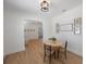 Dining room with round table and views into the living room and entryway at 1110 36Th N Ave, St Petersburg, FL 33704