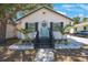 Charming home featuring a welcoming front porch with dark shutters and a cheerful pastel door at 1110 36Th N Ave, St Petersburg, FL 33704