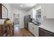 Kitchen featuring stainless appliances, white cabinets, and sleek fixtures at 1110 36Th N Ave, St Petersburg, FL 33704