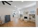 Bright living space with hardwood floors, built-in shelves, and an archway leading to a modern kitchen at 1110 36Th N Ave, St Petersburg, FL 33704