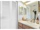 Cozy bathroom features a vanity with a sink, and ample storage space with mirrored cabinet and closet at 11511 113Th St # 35E, Largo, FL 33778