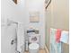 Clean, bright bathroom with shower, toilet with starfish decor, and towel racks at 11511 113Th St # 35E, Largo, FL 33778